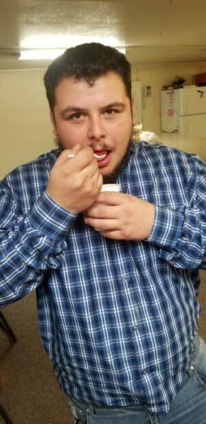 Headshot of youth enjoying ice cream in church fellowship hall