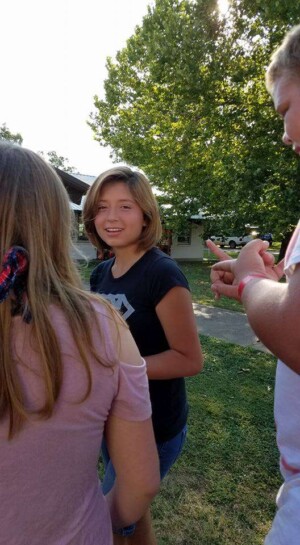 Three Colcord FBC youth between activities at grand lake baptist assembly