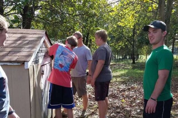 Church Youth repairing lawn shed