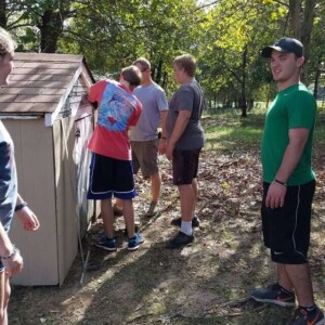 Church Youth repairing lawn shed