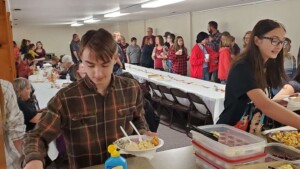 people in line for third sunday meal
