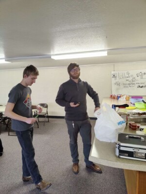 Two youth have a discussion during colcord church taco dinner fundraiser