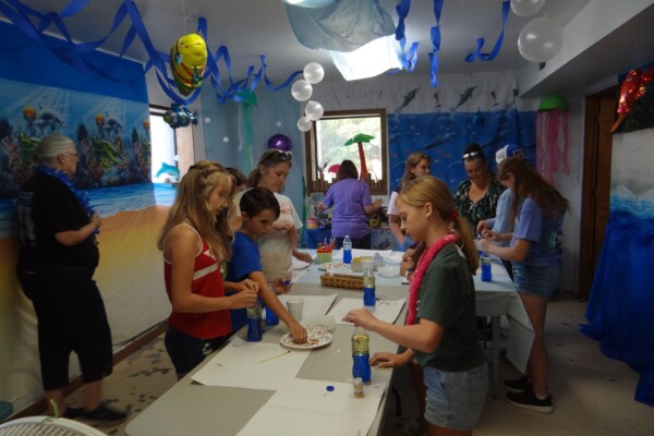 Kids doing crafts activity in the church basement