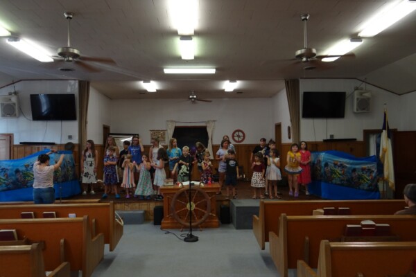 Kids practicing music during vacation bible school at the FBC colcord church building